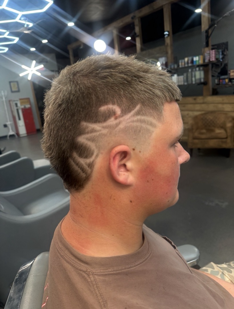 Modern mullet with a freehand razor design