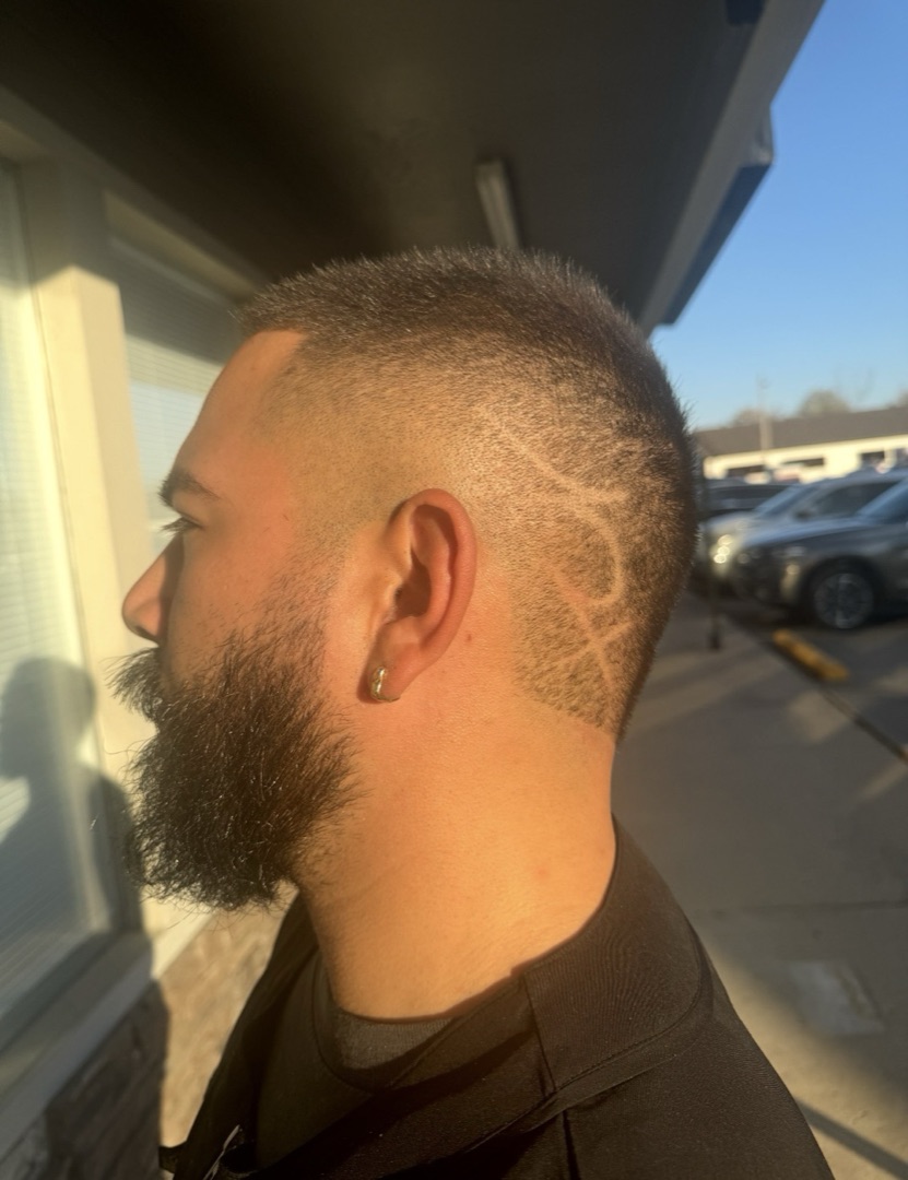 Burst fade with a freehand razor design